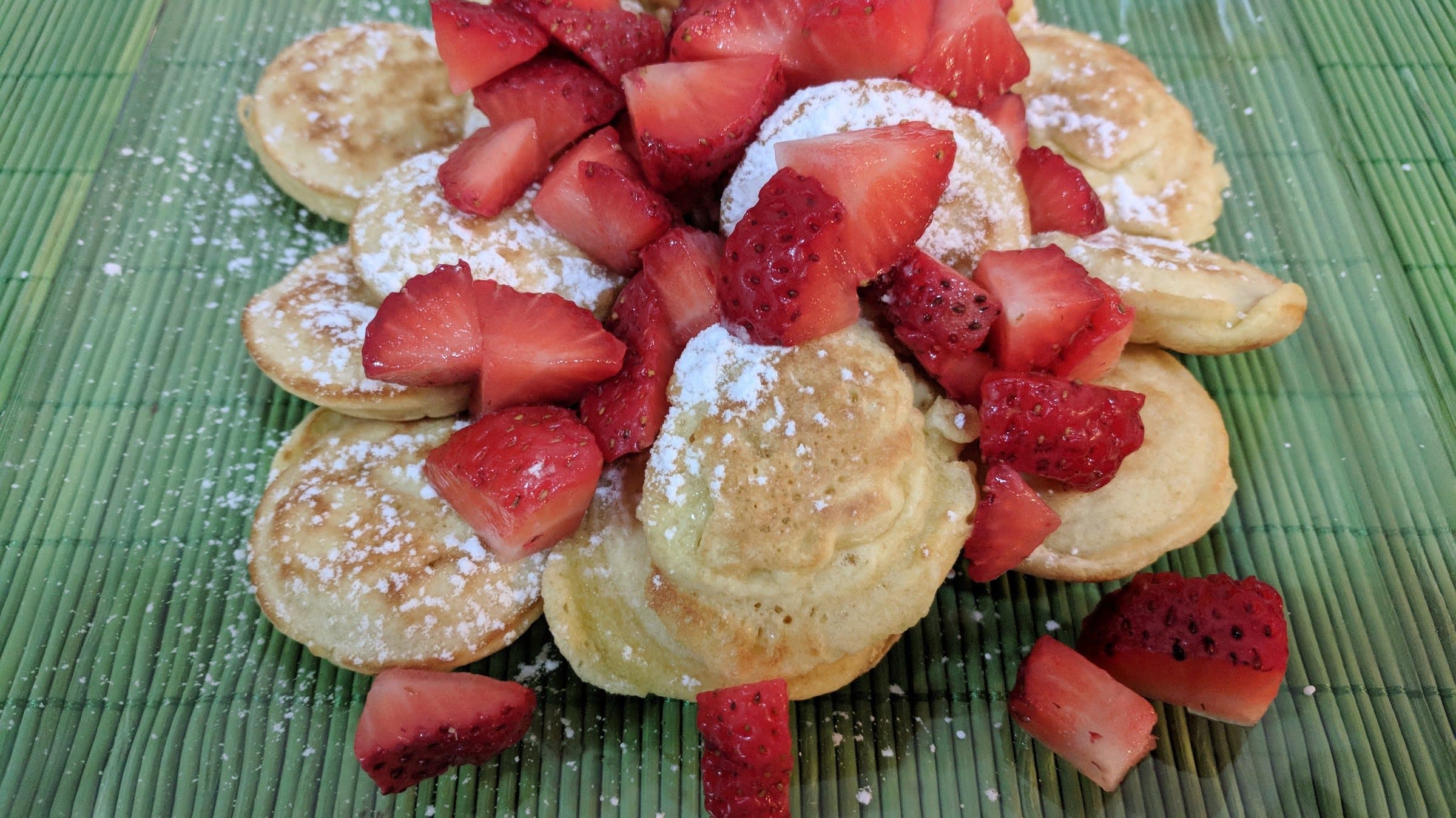 Dutch mini pancakes served with fresh strawberries at a Greater Cincinnati event