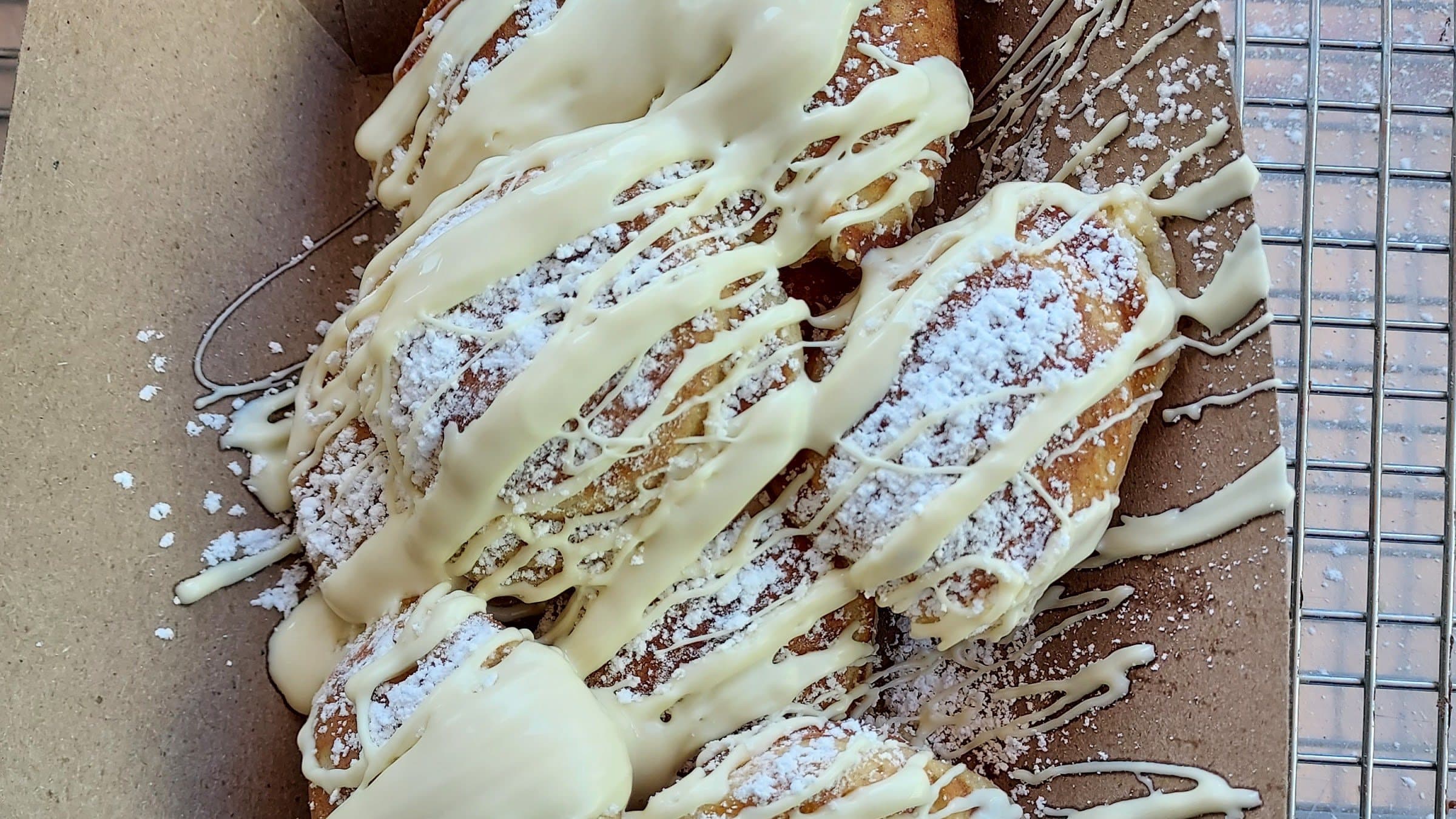 Dutch mini pancakes drizzled with white chocolate and powdered sugar at a Cincinnati wedding